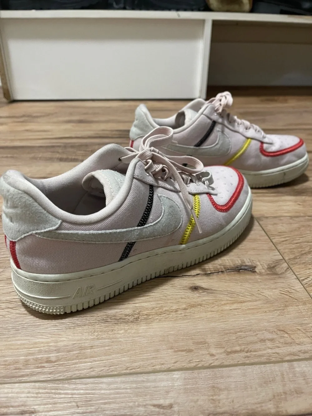 Nike Women's Pale Pink Low-Top Sneakers with Red and Yellow Accents - Picture 2 of 3